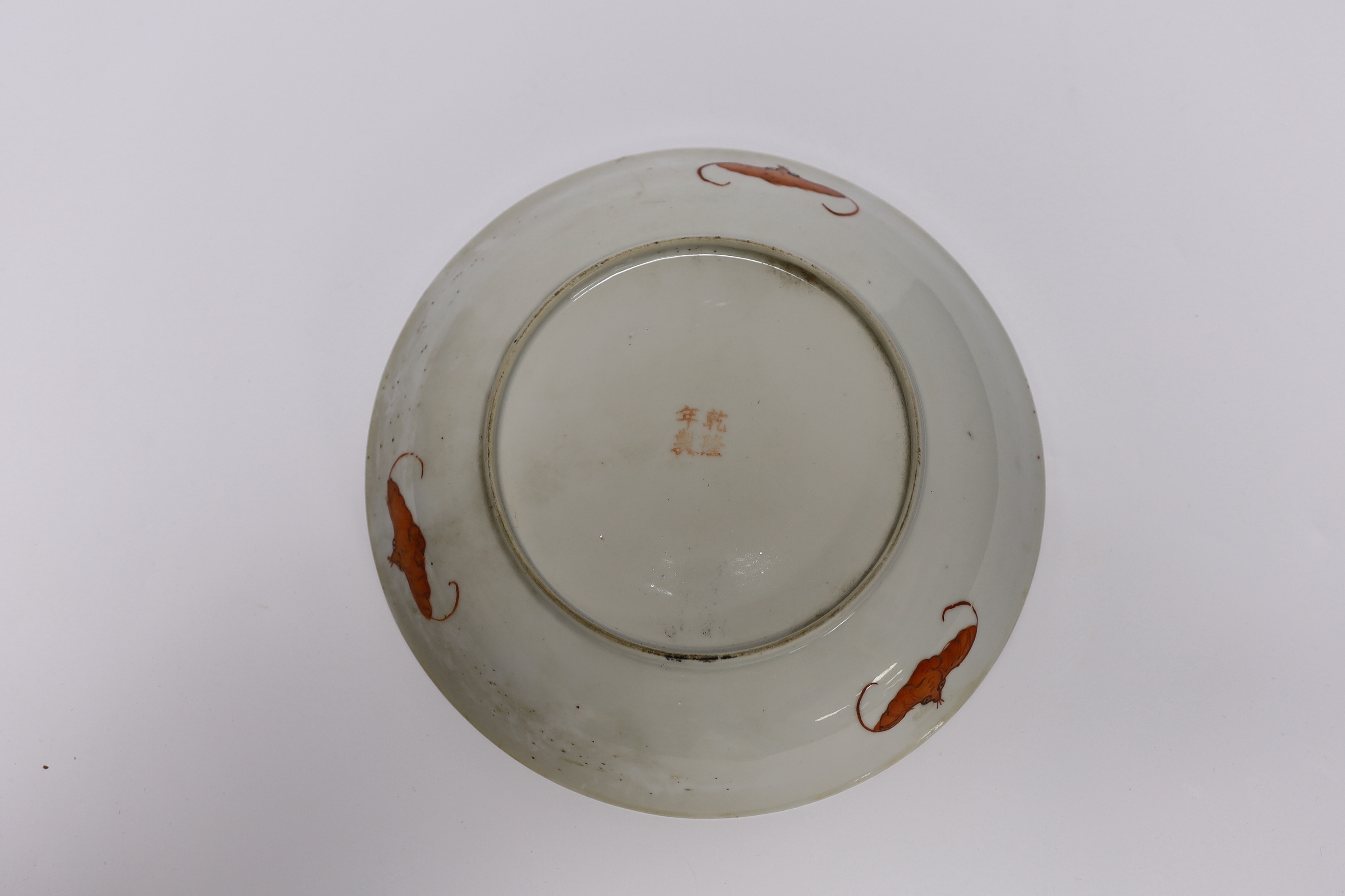 A Chinese famille noire floral dish, Qianlong mark, late 19th/early 20th century and two Chinese enamelled porcelain plates, 19th century, famille noir dish 23.5cm diameter